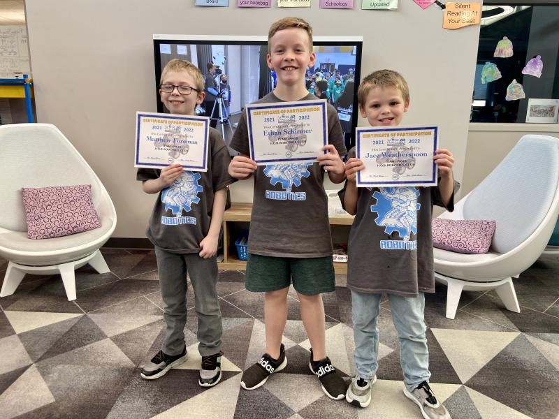 The 19968B team members (l-r) Matthew Foreman, Ethan Schirmer and Jace Weatherspoon received certificates for their work.